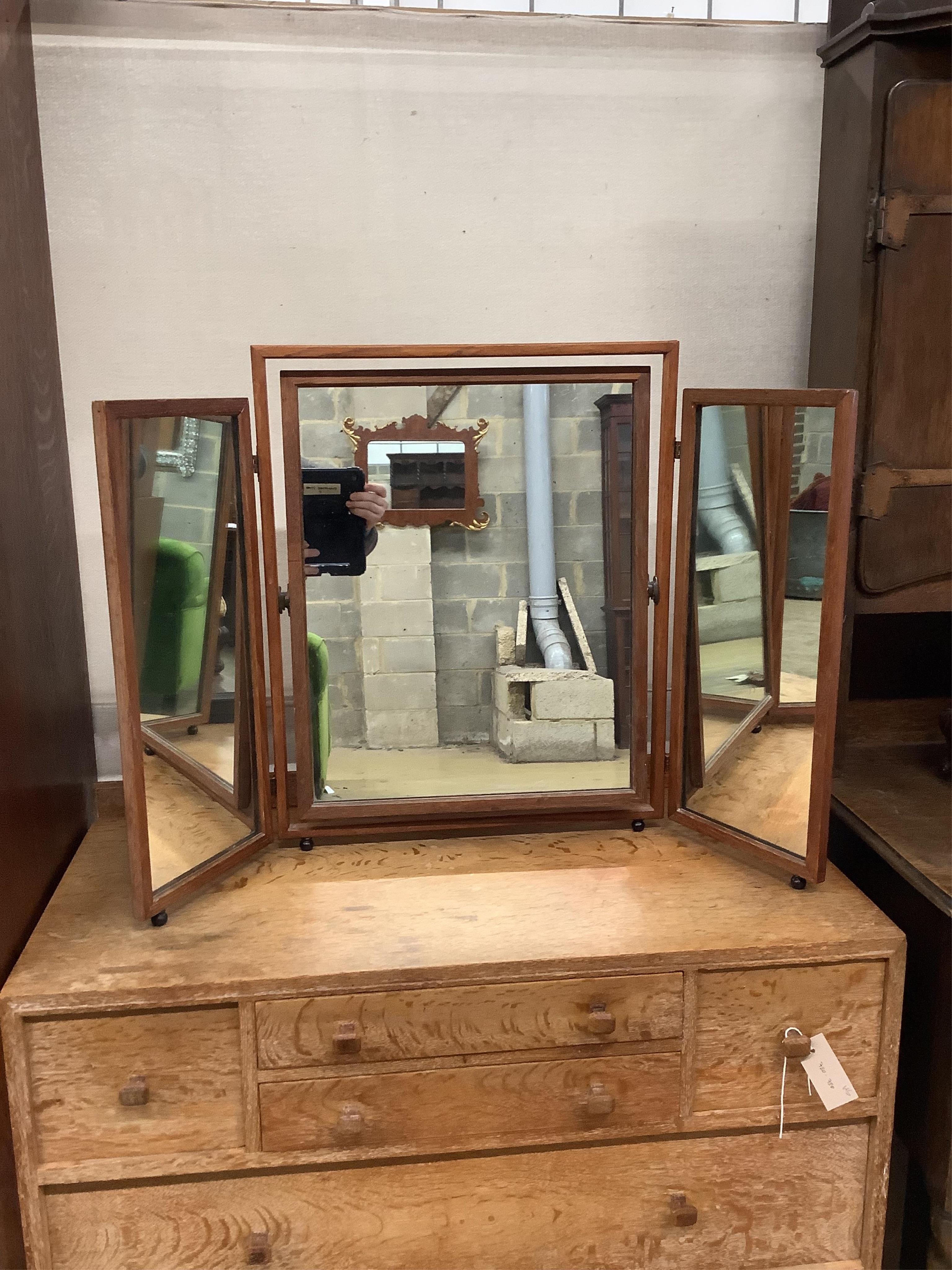 Heal & Son Ltd. A weathered oak six drawer chest, width 91cm, depth 47cm, height 80cm, and a triple dressing table mirror. Condition - fair